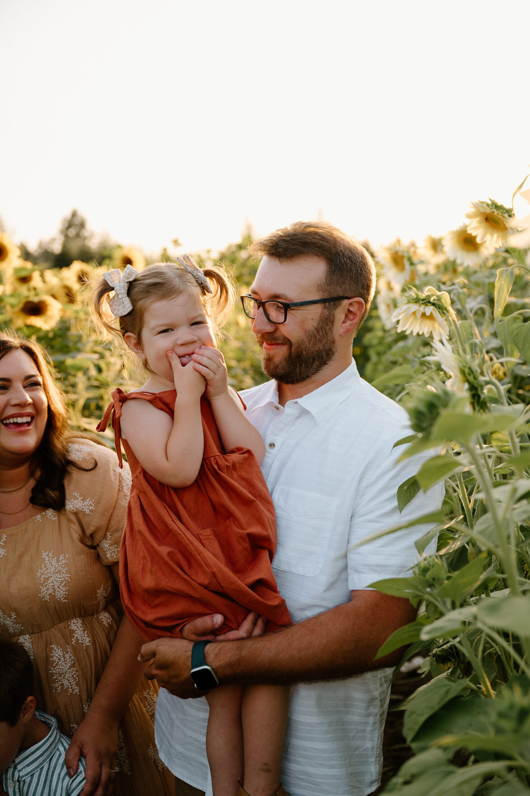Family portrait in sunflowers taken by PNW Family Photographer.