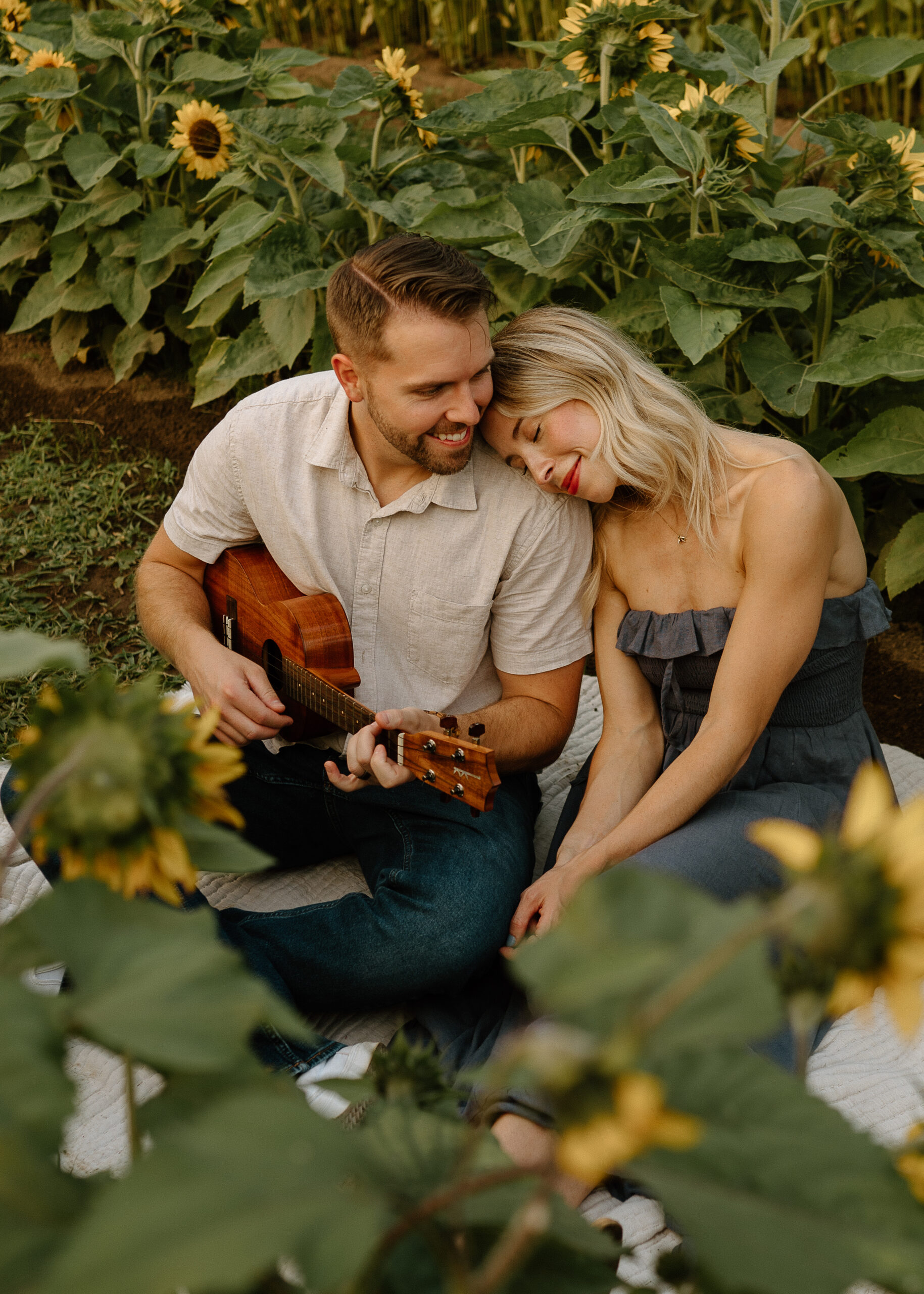 Couple Photo in sunflowers by PNW family photographer Forgette Photo. 