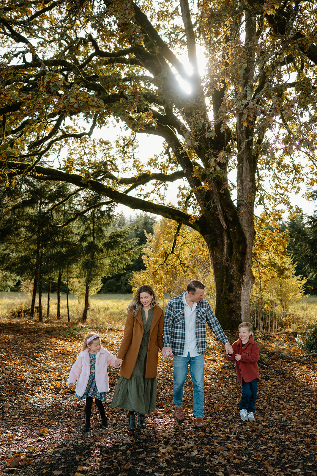 Family photograph in trees taken by Vancouver, Washington family photographer.
